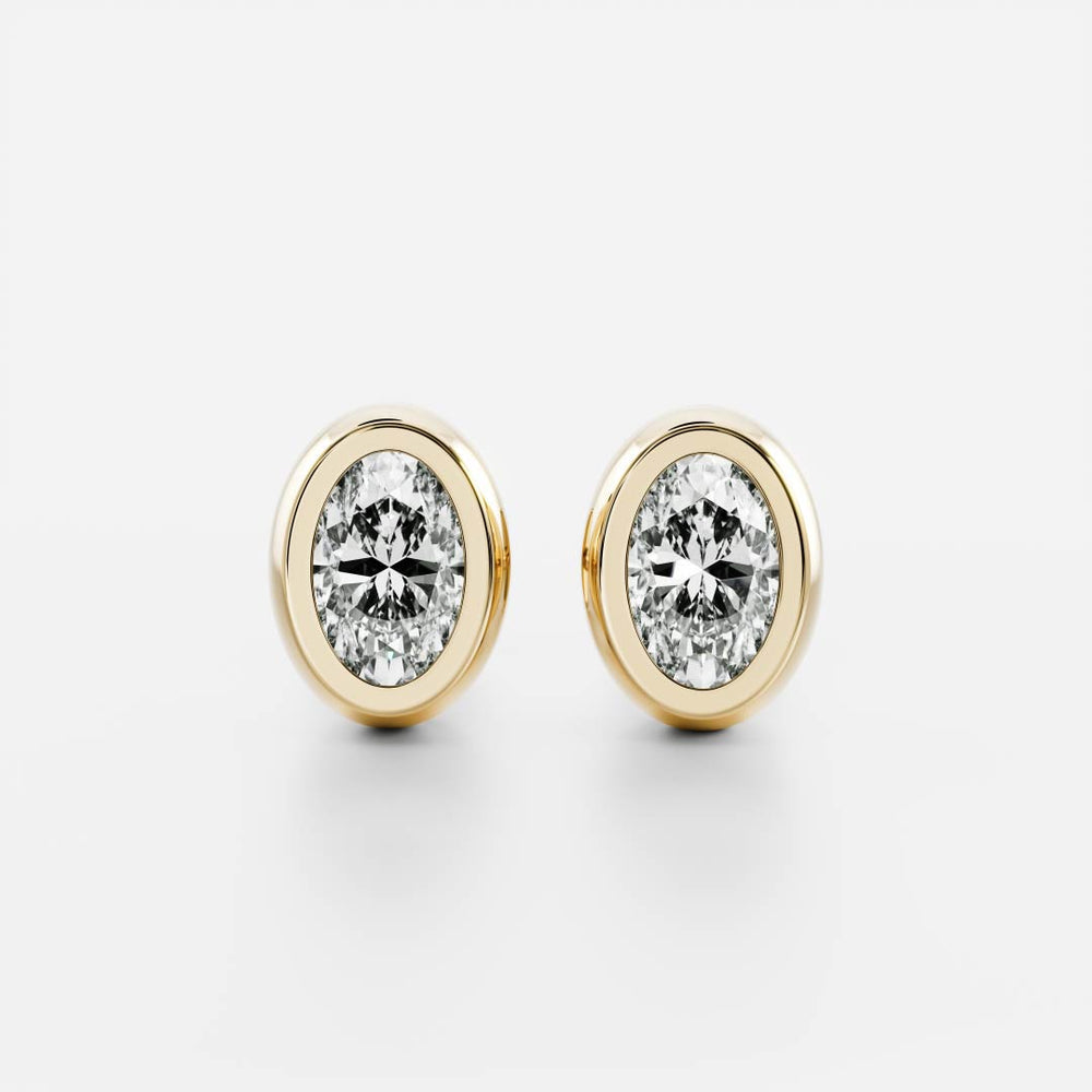 0.50 TCW Oval Cut Moissanite Bezel Stud Earrings in Gold 1