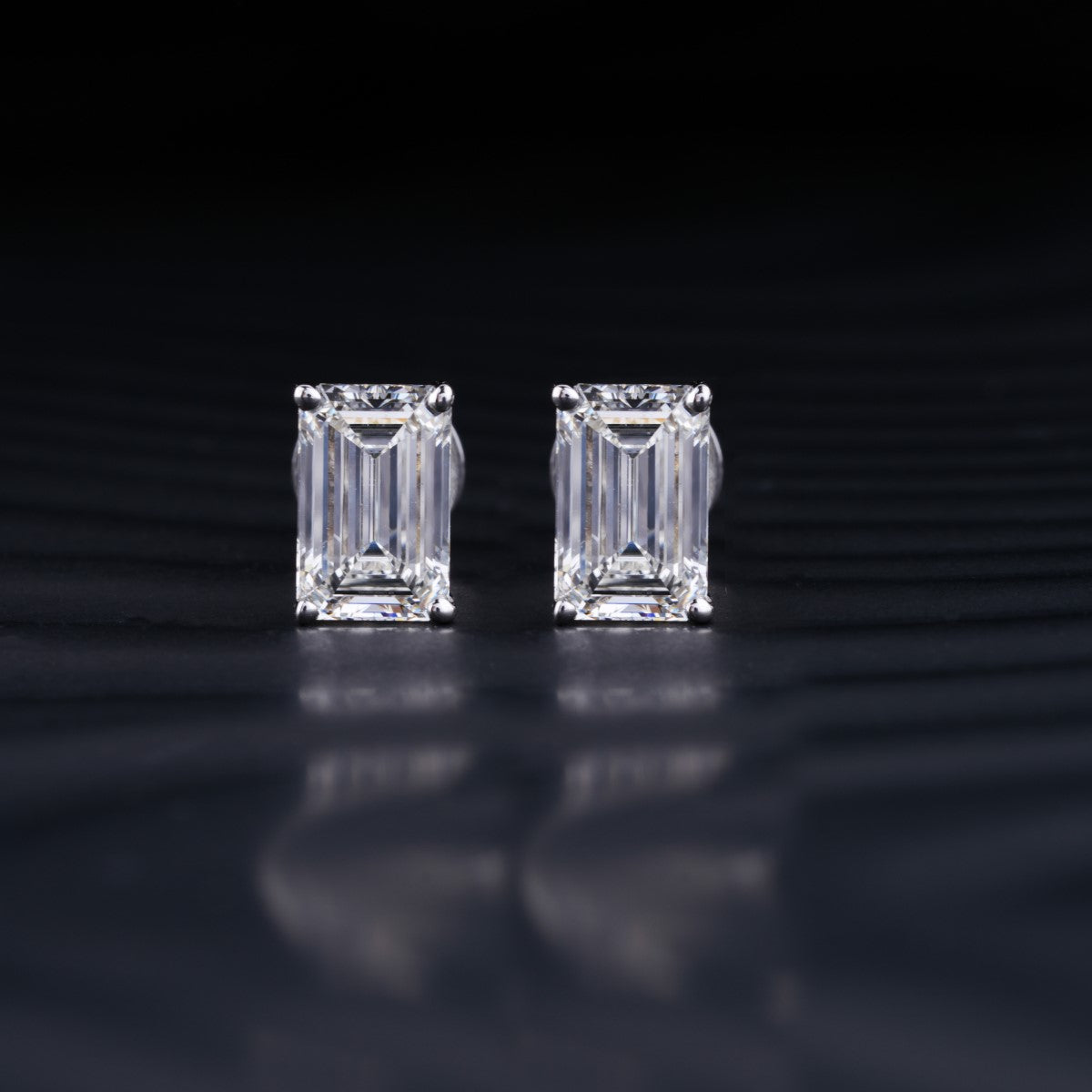 2.0 TCW Emerald Cut Moissanite Stud Earrings in Gold 1