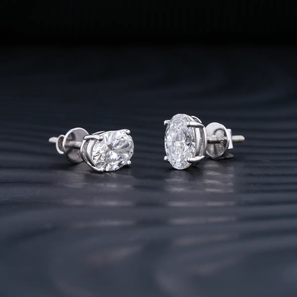 2.0 TCW Oval Cut Moissanite Stud Earrings in Gold 1