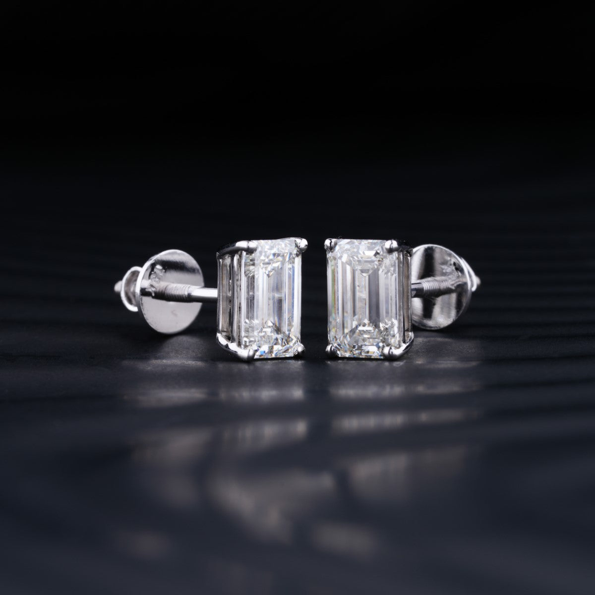 2.0 TCW Emerald Cut Moissanite Stud Earrings in Gold 2